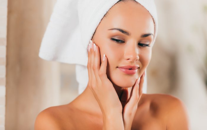 gorgeous woman in bath robe with perfect clean face