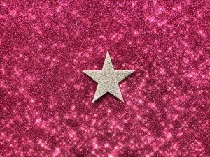 gold star on pinkish red glittering background 2022 11 12 01 22 34 utc