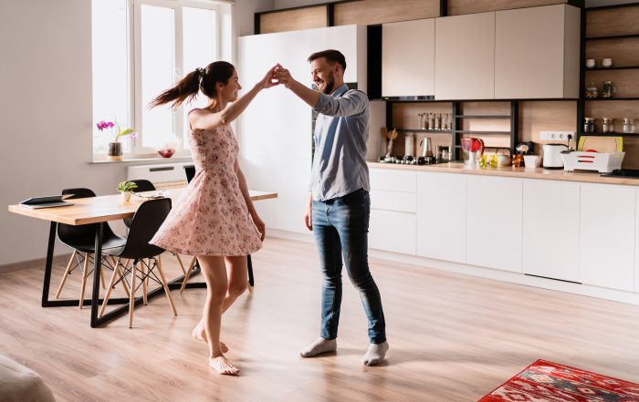 Man and woman dancing in a modern interior