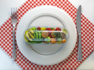 Pill or capsule with fruit and vegetable in a plate. Nutritional
