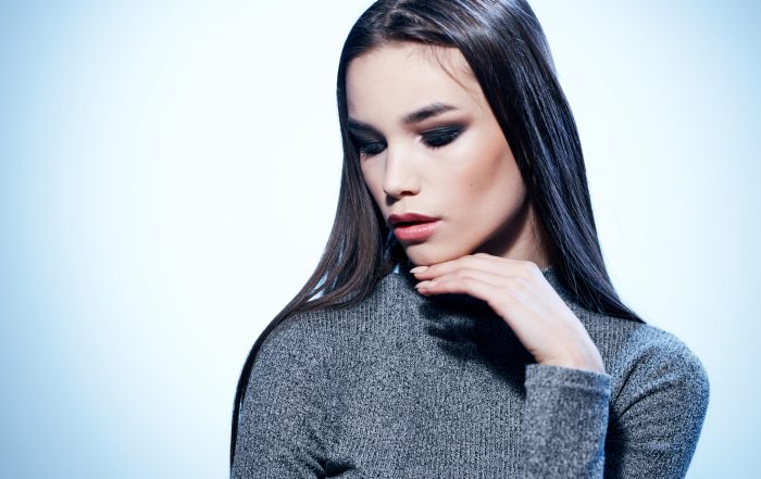 Pretty lady in gray sweater makeup model close up portrait