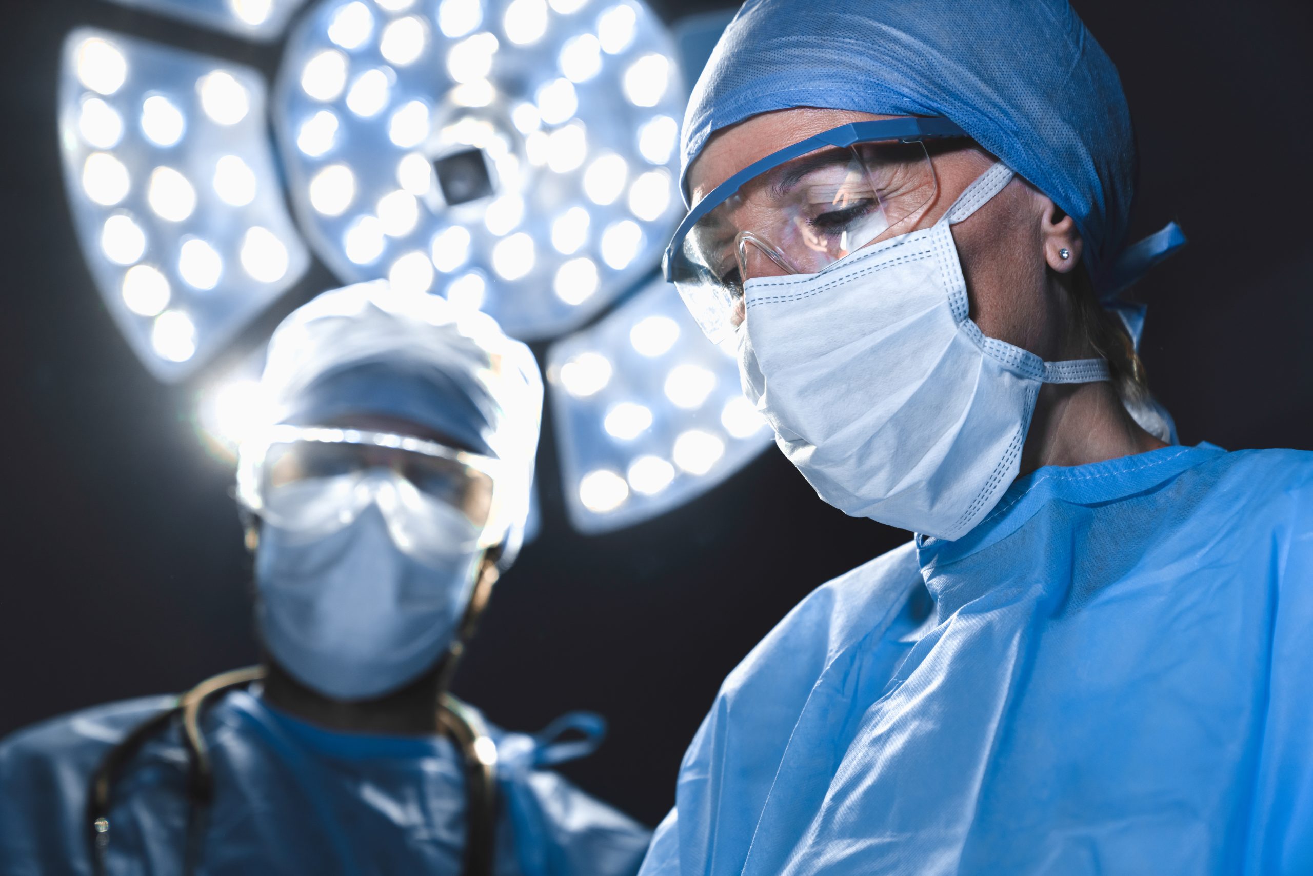 Medical professionals during surgery operating room.